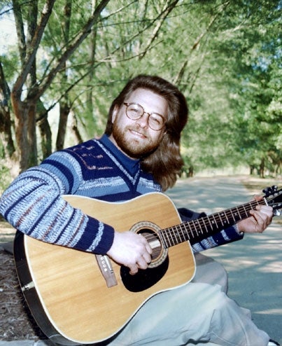 Kind, Bearded Christian Has Guitar, Story To Tell