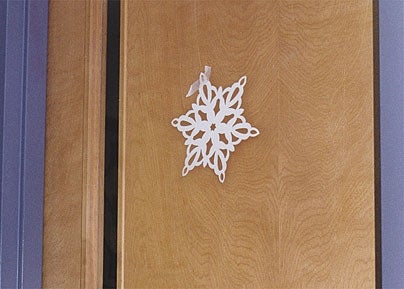 Cardboard Snowflake Half-Heartedly Masking-Taped To Break-Room Door