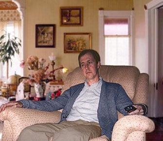 Man In Chair Pauses To Consider Reclining Options