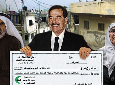 Saddam Hussein Presents Suicide Bomber's Family With Oversized Check