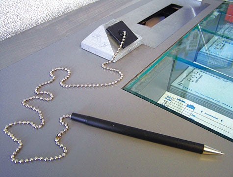 Chained Pen Yearns To Visit Rest Of Bank