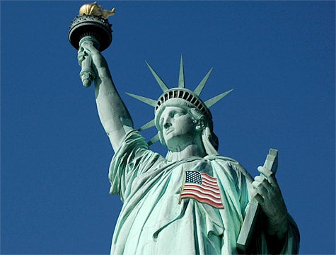 40-Foot American Flag Pin Welded To Statue Of Liberty