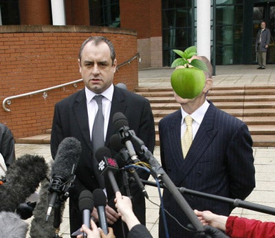 Man With Apple Hovering In Front Of Face Sues René Magritte's Estate