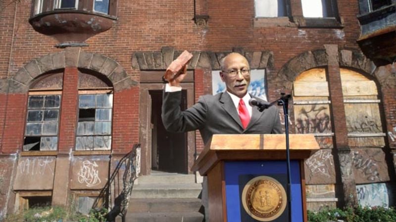 Detroit Mayor Throws First Brick In Glass-Breaking Ceremony For New Slum