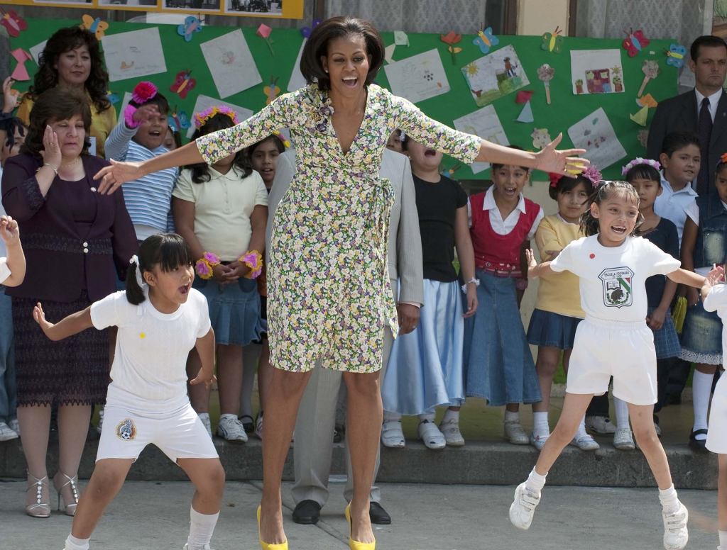 Michelle Obama Powers Through Another Day Of Doing Half-Assed Jumping Jacks In Middle School Gym