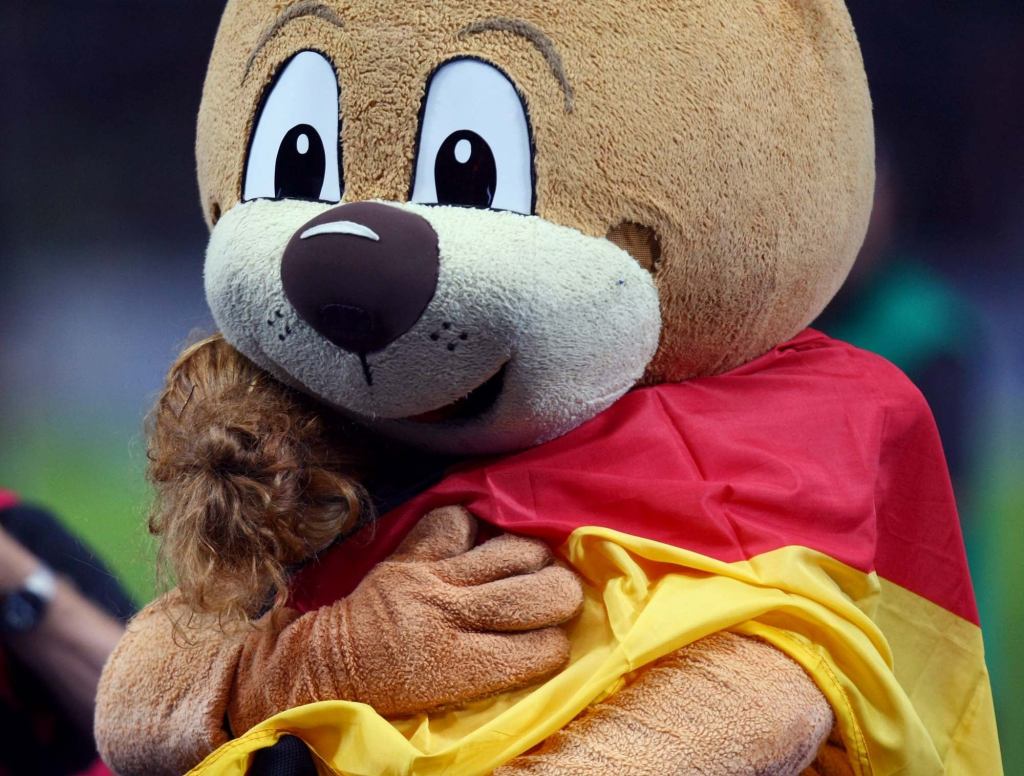 No-Nonsense Mascot Gets Right Down To Business, Hugs Child