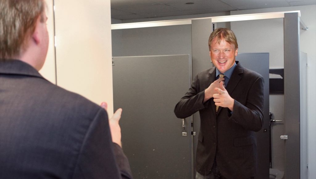 Jon Gruden Drawing Interest From Smiling Guy In Mirror