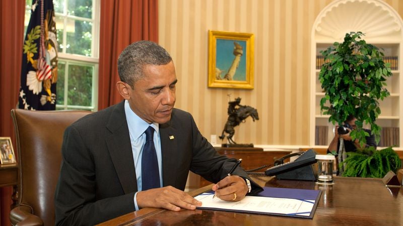 Photojournalist Spends Month In Oval Office Blind To Capture Images Of Obama In Natural Habitat