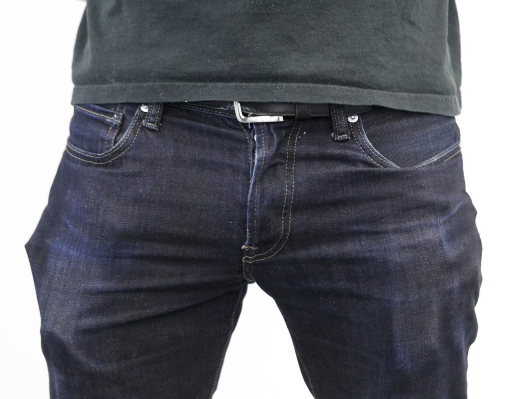 Bizarre Assemblage Of Shapes Visible Through Area Man's Pockets