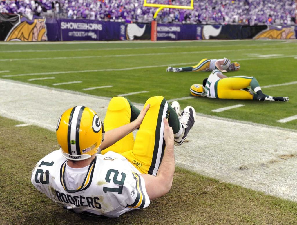 Packers Warm Up By Rolling Around On Field Clutching Knees