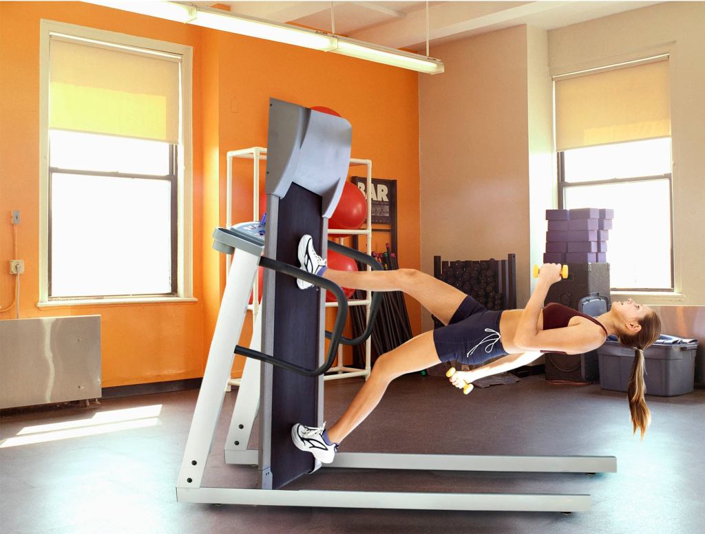 Woman On Gym Treadmill Cranks Incline Up To 90 Degrees