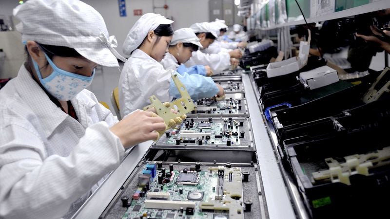 Chinese Factory Workers Fear They May Never Be Replaced With Machines