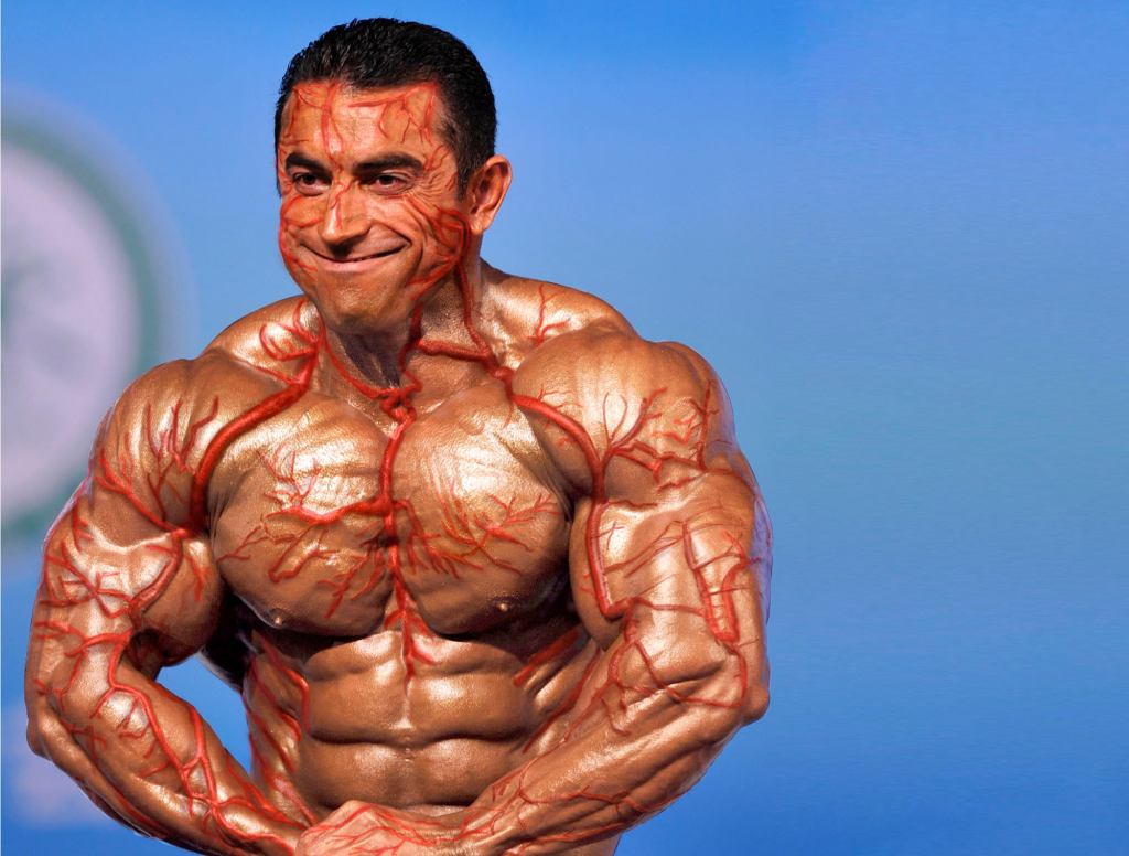 Bodybuilder's Veins Now Outside Of His Skin