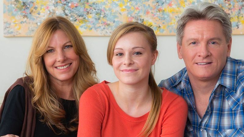 Family Impressed By Extra Effort Father Putting In To Hide Drinking