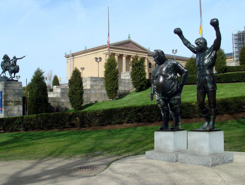 Philadelphia Museum Of Art Erects Statue Of Overweight Tourist Posing Next To Rocky Statue