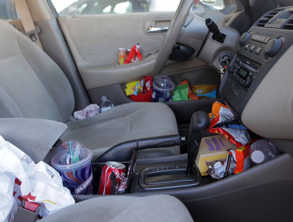 Every Conceivable Nook In Car Stuffed With Trash By Second Hour Of Road Trip