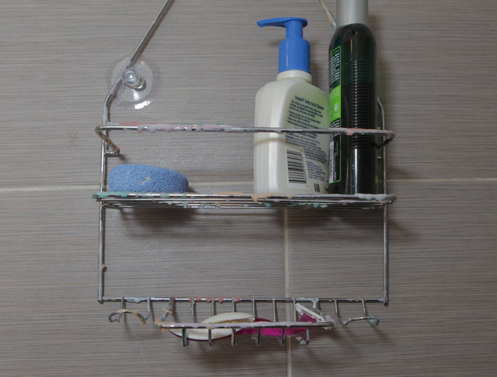 Shower Caddy Coated In Dazzling Multicolor Array Of Various Soap Films