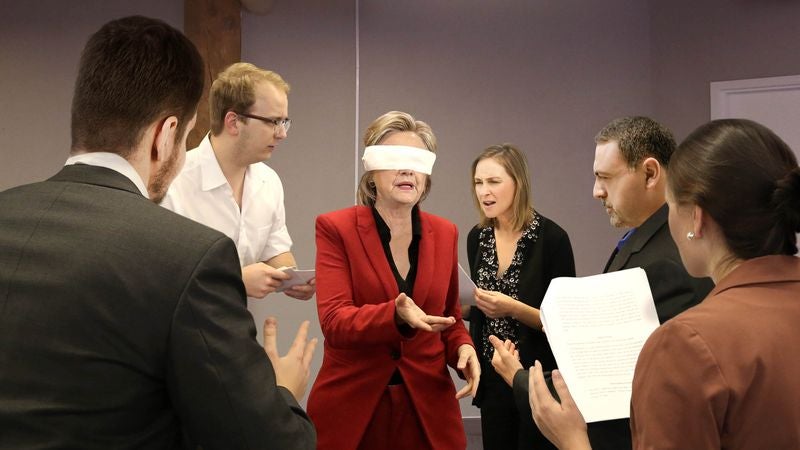 Blindfolded Clinton Invites Debate Coaches To Attack Her With Talking Points From All Sides