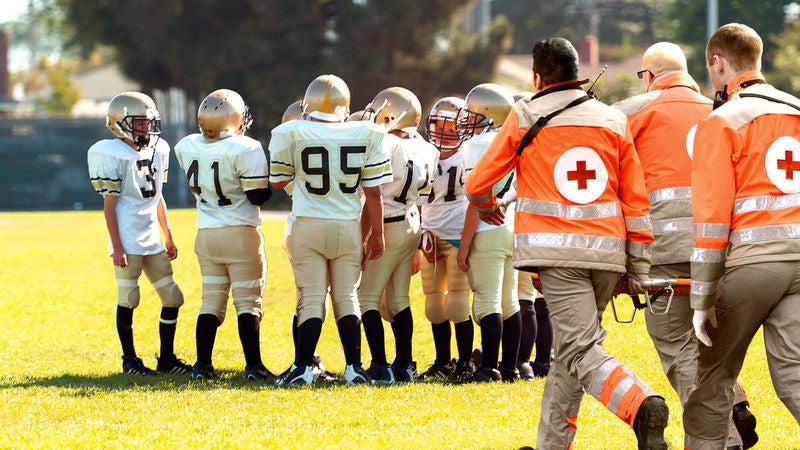 Emergency Crew Rushes To Pull Child Out Of Football Huddle