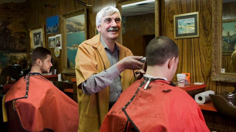 Man Feeling Pressure To Live Up To Conversation Between Barber And Customer In Next Chair