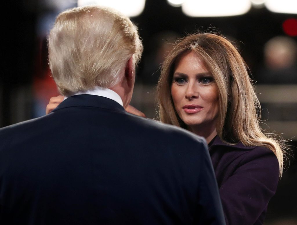 Melania Trump Straightens Husband’s Neck Skin Before Walking Out Onto Inauguration Platform