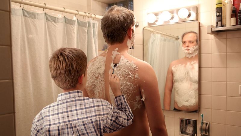 Father Teaches Son How To Shave Him