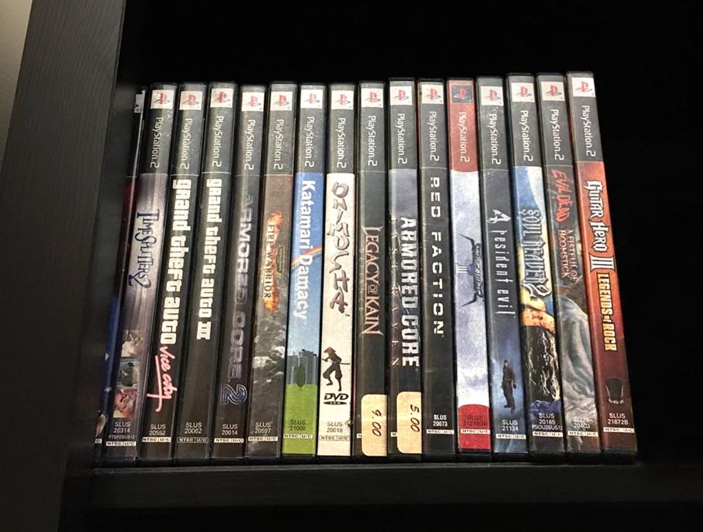 Row Of Dusty PlayStation 2 Games Continues Reign At Top Of Book Shelf