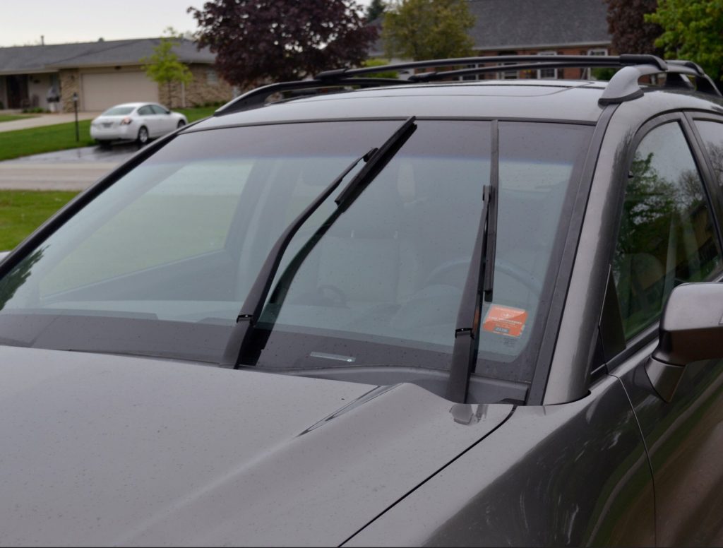 Car Parked With Windshield Wipers Halfway Up Offers Glimpse Of World Suspended In Time