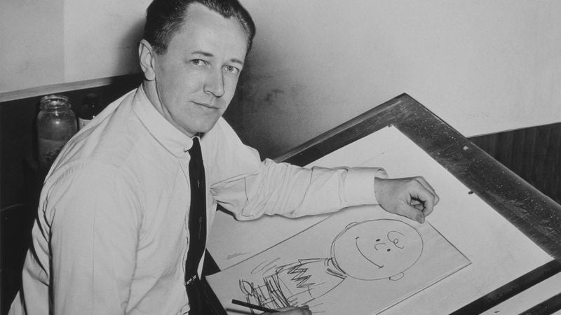 Charles Schulz Estate Releases Hundreds Of Rare, Never-Before-Seen Images Of Him Posing Next To An Easel