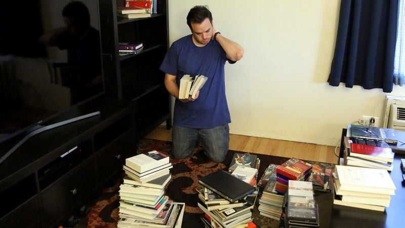 Man 20 Minutes Into Organizing Shelves Becomes Grimly Aware Of What Chaos He Has Wrought