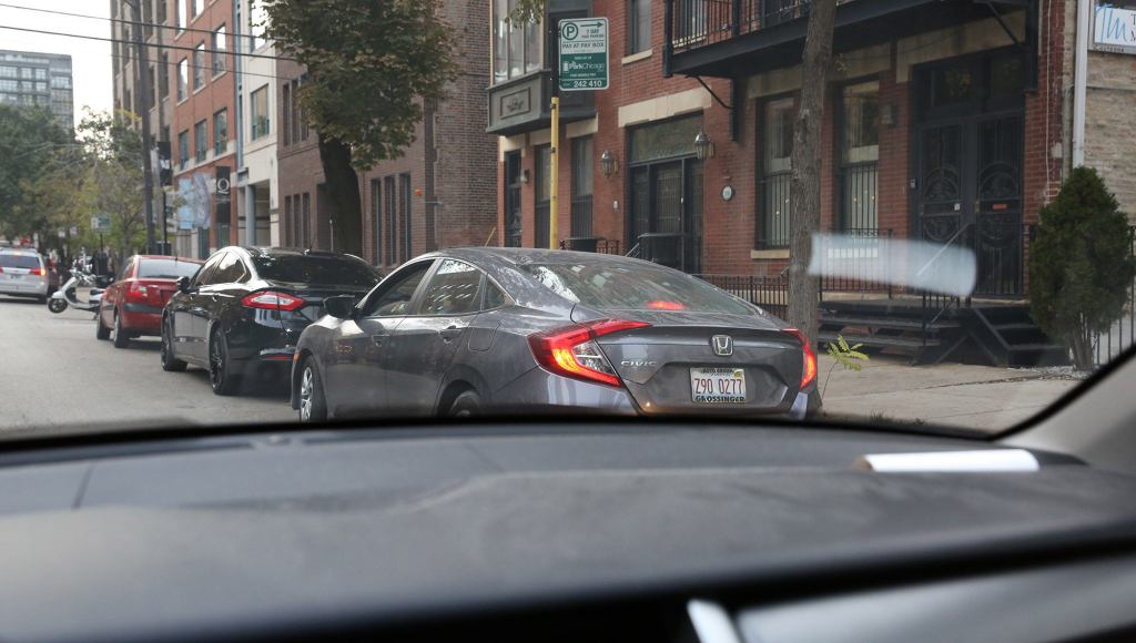 Car Passengers Launch Urgent, Mid-Street Investigation Into Whether Woman In Parking Spot Coming Or Going