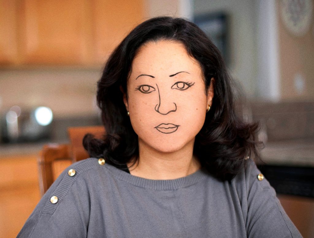 Woman Has Drawn-On Eyebrows, Nose, Eyes, Mouth