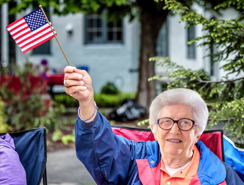 Old Lady At Parade Flapping Little American Flag Like A Motherfucker