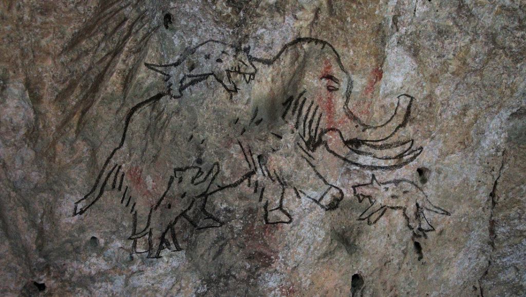 Unearthed Cave Painting Of Wooly Mammoth, Saber-Tooth Tiger Reveals Humans Have Debated What Things Would Win In A Fight Since 30,000 B.C.