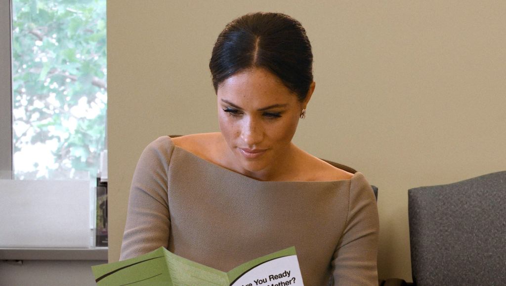 Meghan Markle Nervously Looking Over Clinic Pamphlets Weighing Her Options