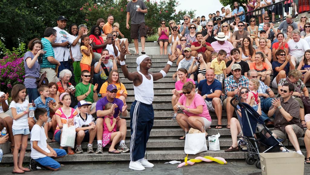 Nation’s Tourists Announce Plans To Form Circle, Clap Hands Around Guys Doing Flips And Stuff