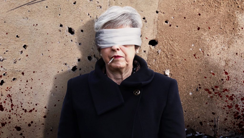 Theresa May Narrowly Manages To Survive Parliamentary Firing Squad