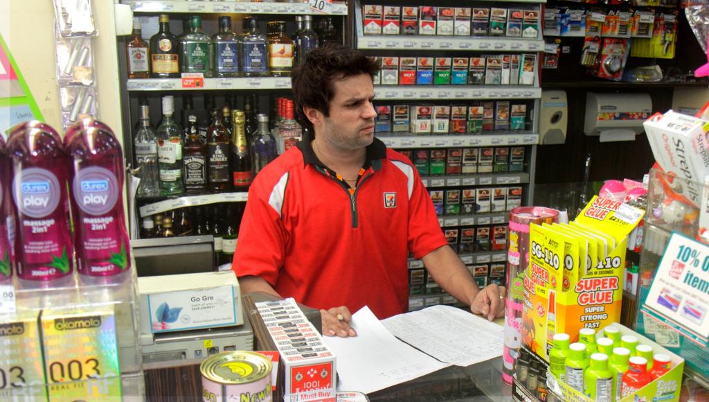 Customers Relieved To See Perky 7-Eleven Cashier’s Spirit Has Finally Been Crushed