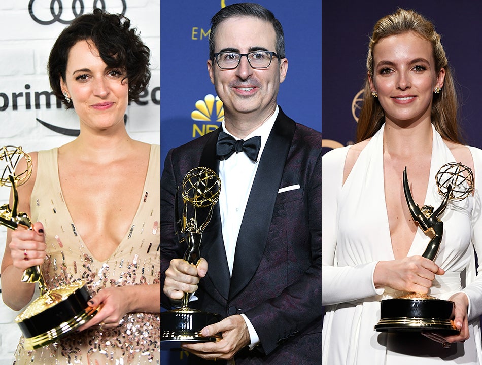 ‘All In Service To The Crown,’ Chant Prostrate Phoebe Waller-Bridge, John Oliver, Jodie Comer Dutifully Surrendering Emmy Statuettes To Queen Elizabeth