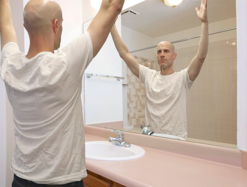 Self-Conscious NFL Referee Practices Raising Both Arms In Front Of Bathroom Mirror Before Game