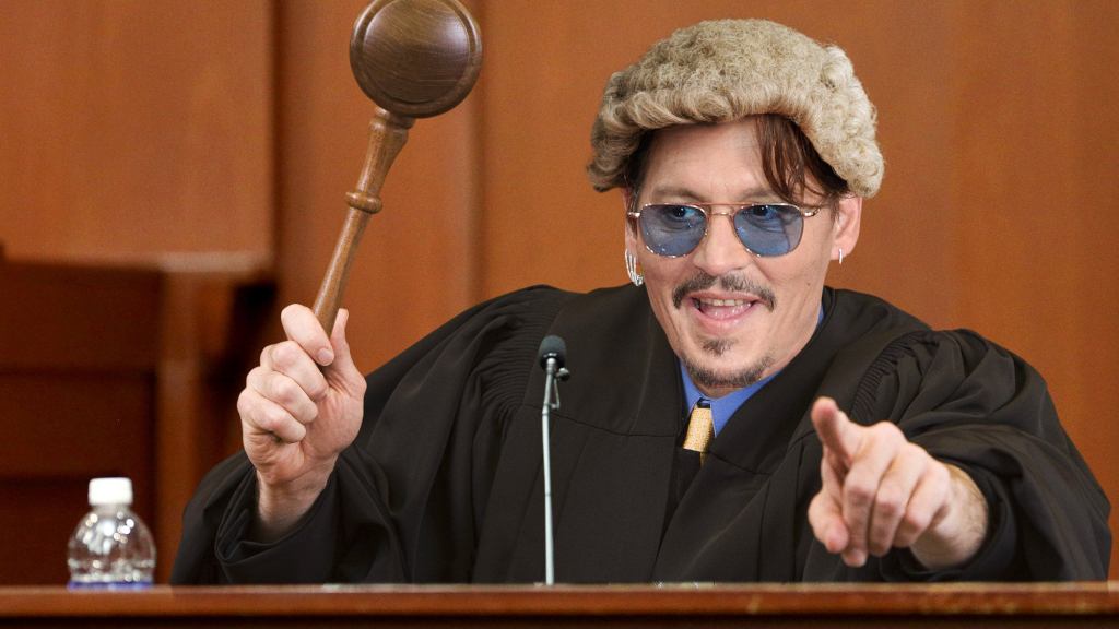 Johnny Depp Interrupts Libel Case To Duck Behind Witness Stand, Pop Up In Judge’s Robes Banging Oversized Gavel