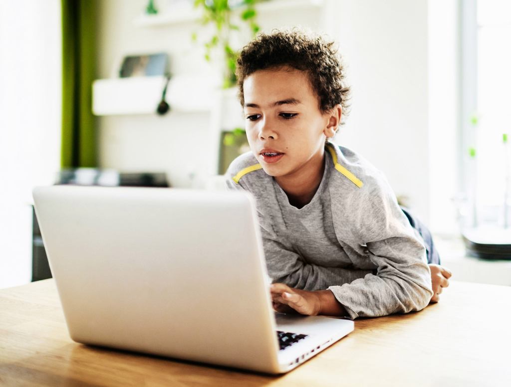 Elementary Student Learning Microsoft Word Goes Straight For Center Justify