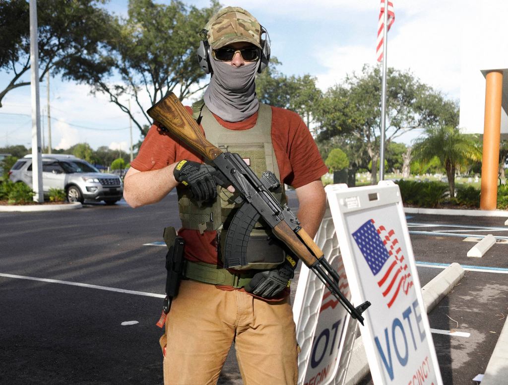 Man Standing Outside Polls With AK-47 Just There To Protect People From Voting