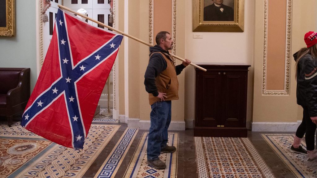 FBI Narrows Down Identity Of Red-Faced Man Carrying Confederate Flag Through Capitol To Millions Of Americans