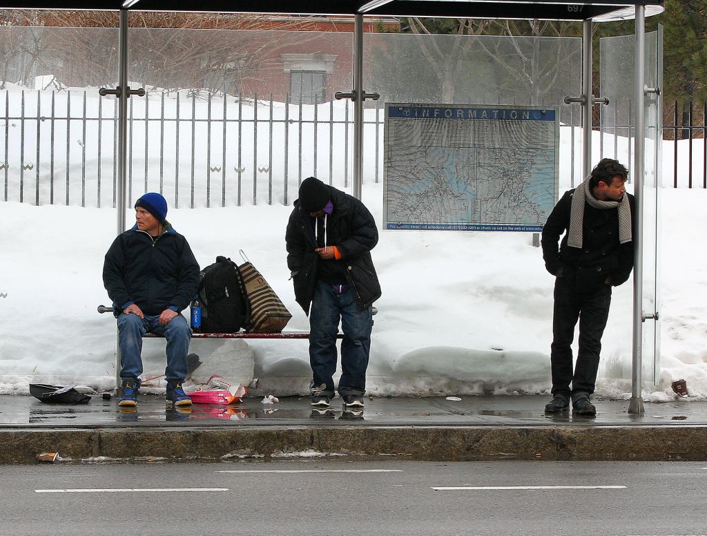 Unmasked Members Of Daft Punk Obliviously Stand Near Each Other At Bus Stop