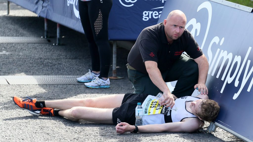 Marathon Runner Collapses A Little Too Early To Be Compassionately Helped Across Finish Line