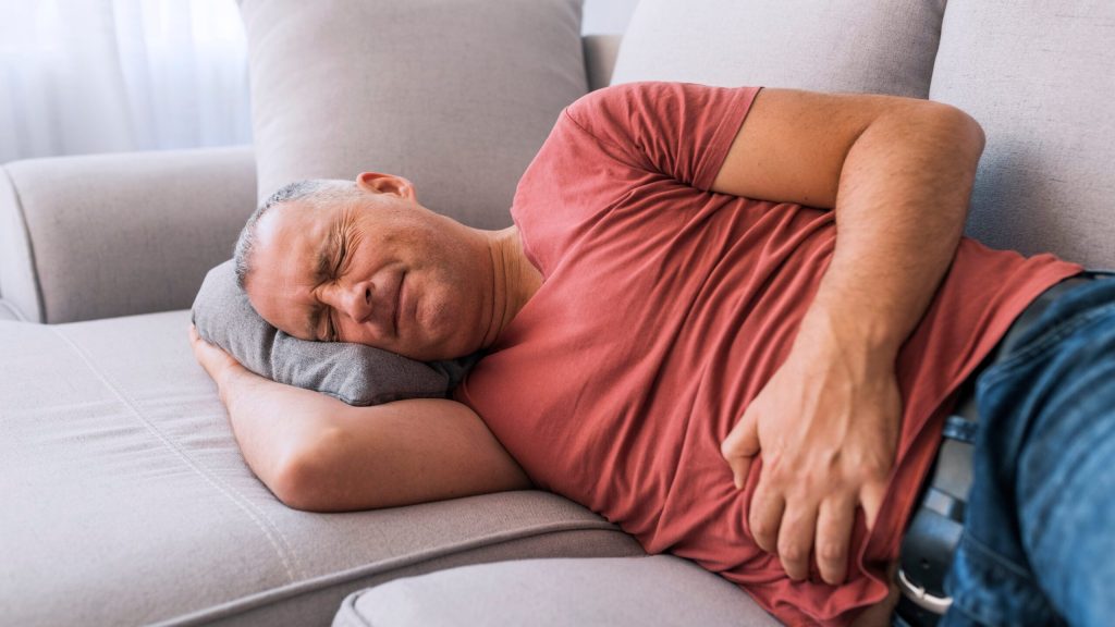 Man Reminds Himself That Painful, Nauseating Side Effects Just Means That Triple Bacon Cheeseburger Working