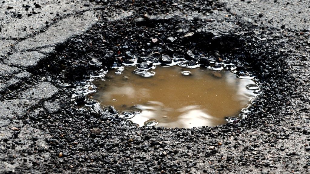 Neighborhood Rallies To Designate Pothole As Historic Landmark