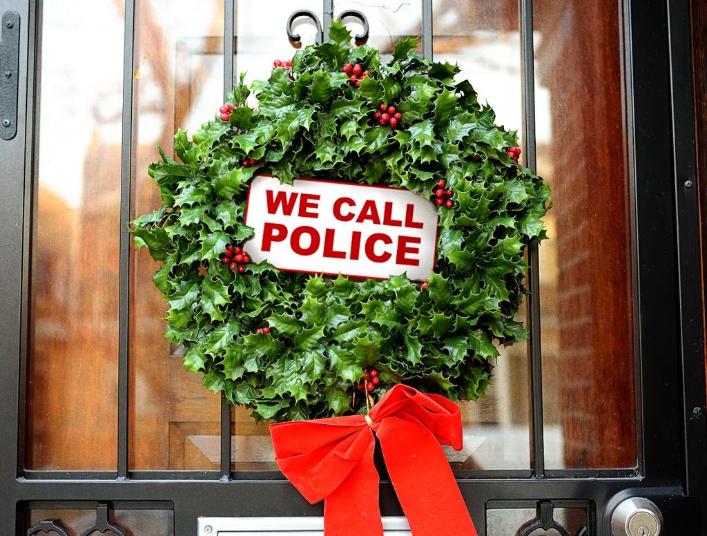 Landlord Positions ‘We Call Police’ Sign In Middle Of Christmas Wreath