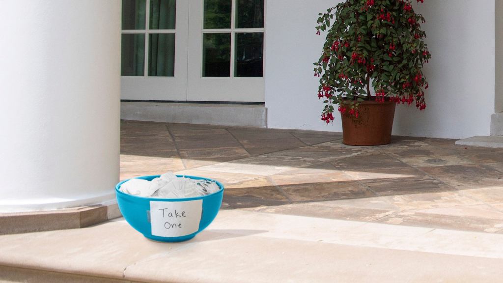 Sign Reading ‘Take One’ Placed On Bowl Of N95 Masks On White House Stoop